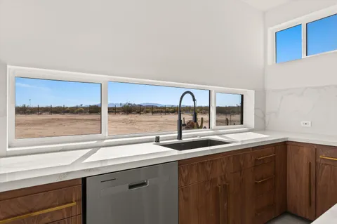 a stove top oven sitting inside of a kitchen
