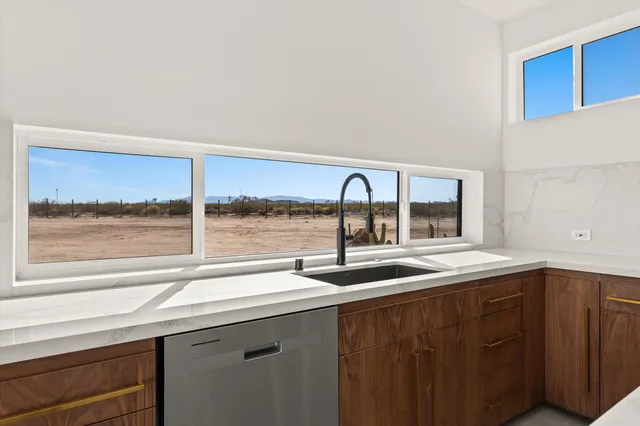 a stove top oven sitting inside of a kitchen
