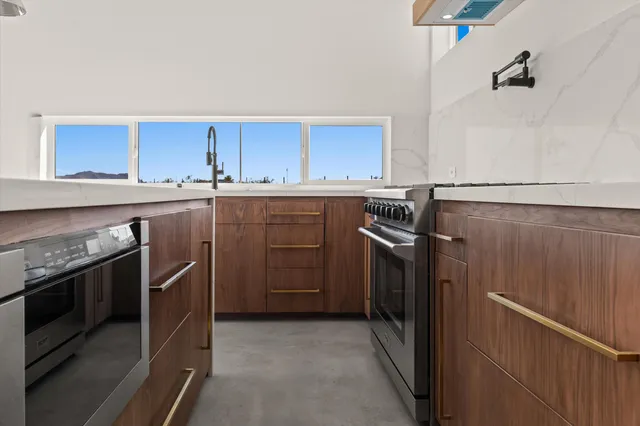 a view of a room with a sink and window