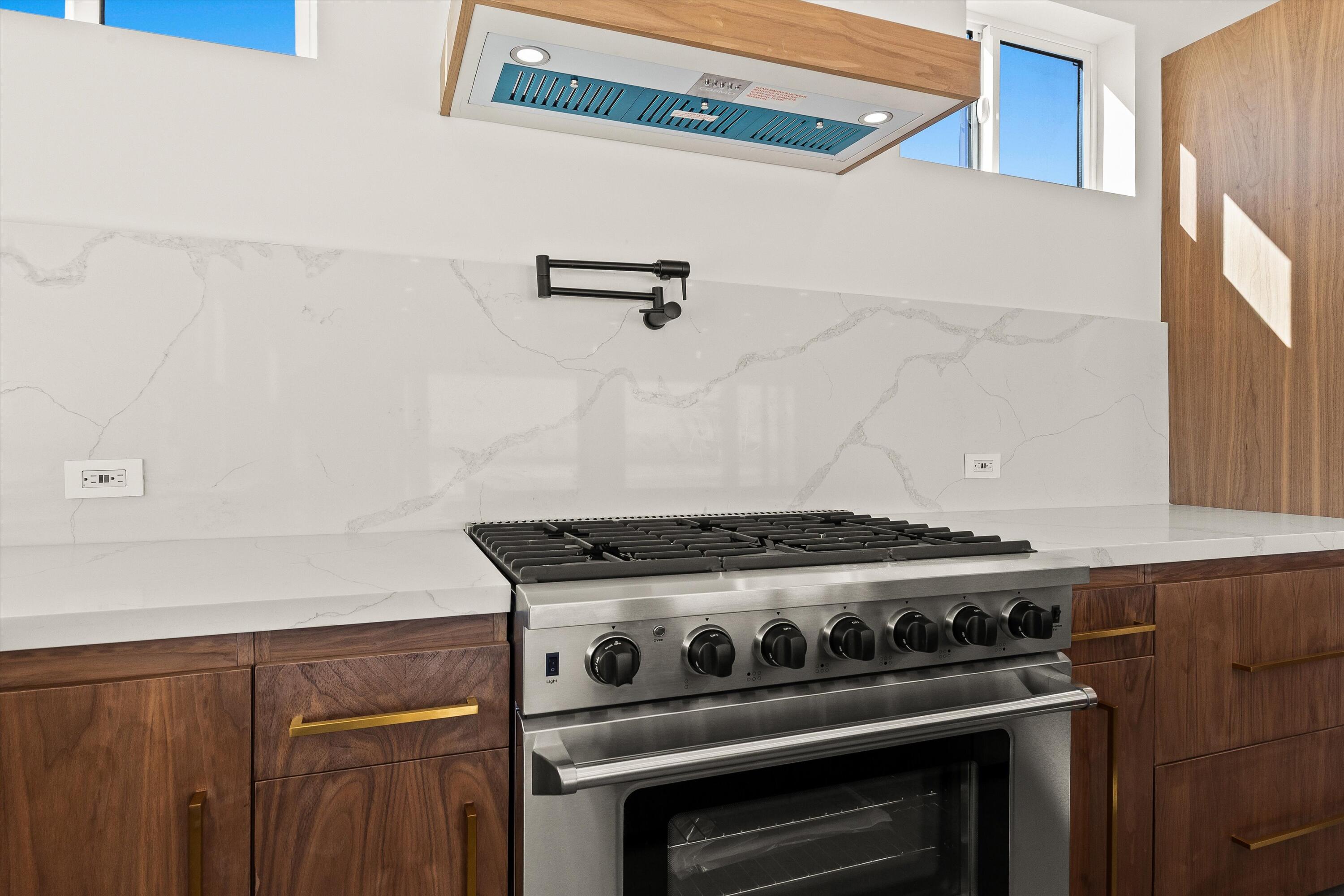 1925 Border Avenue Joshua Tree, CA 92252 - Photo 14 of 60 a stove top oven sitting inside of a kitchen