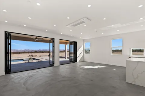 a view of a dining room with furniture window and outside view