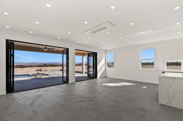 a view of a dining room with furniture window and outside view