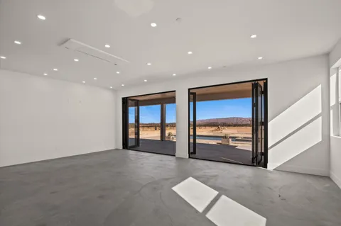 a view of a livingroom with a patio and a yard