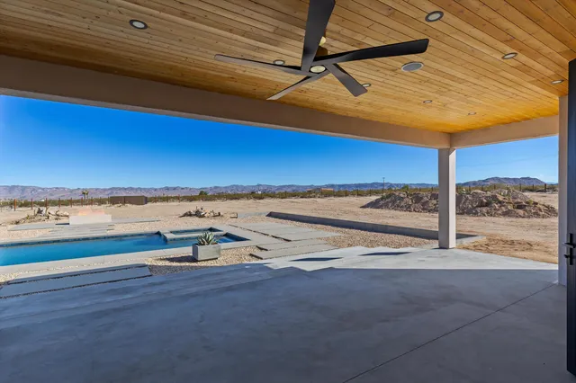a view of swimming pool with outdoor seating