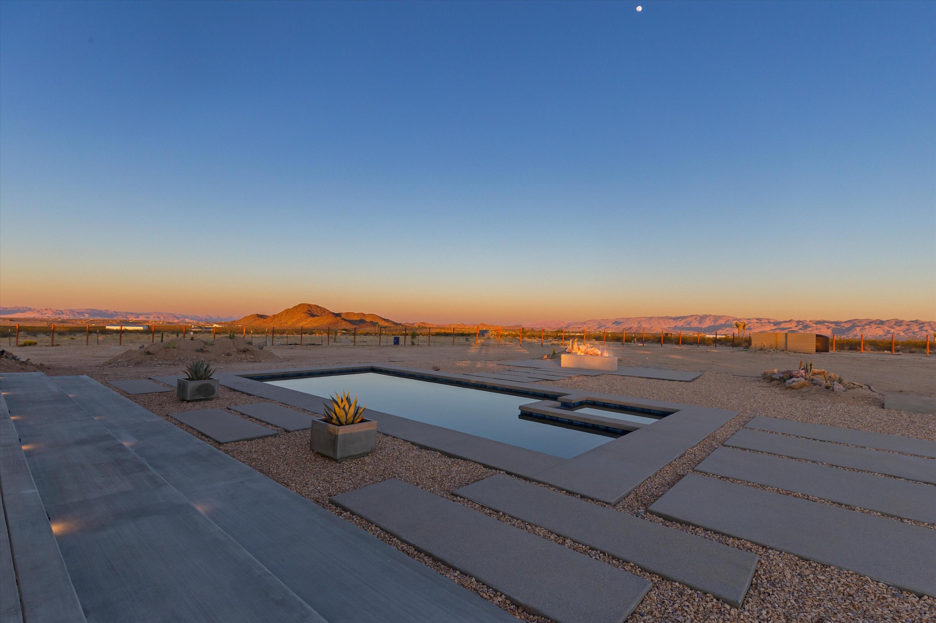 1925 Border Avenue Joshua Tree, CA 92252 - Photo 24 of 60 a view of a terrace with a lake