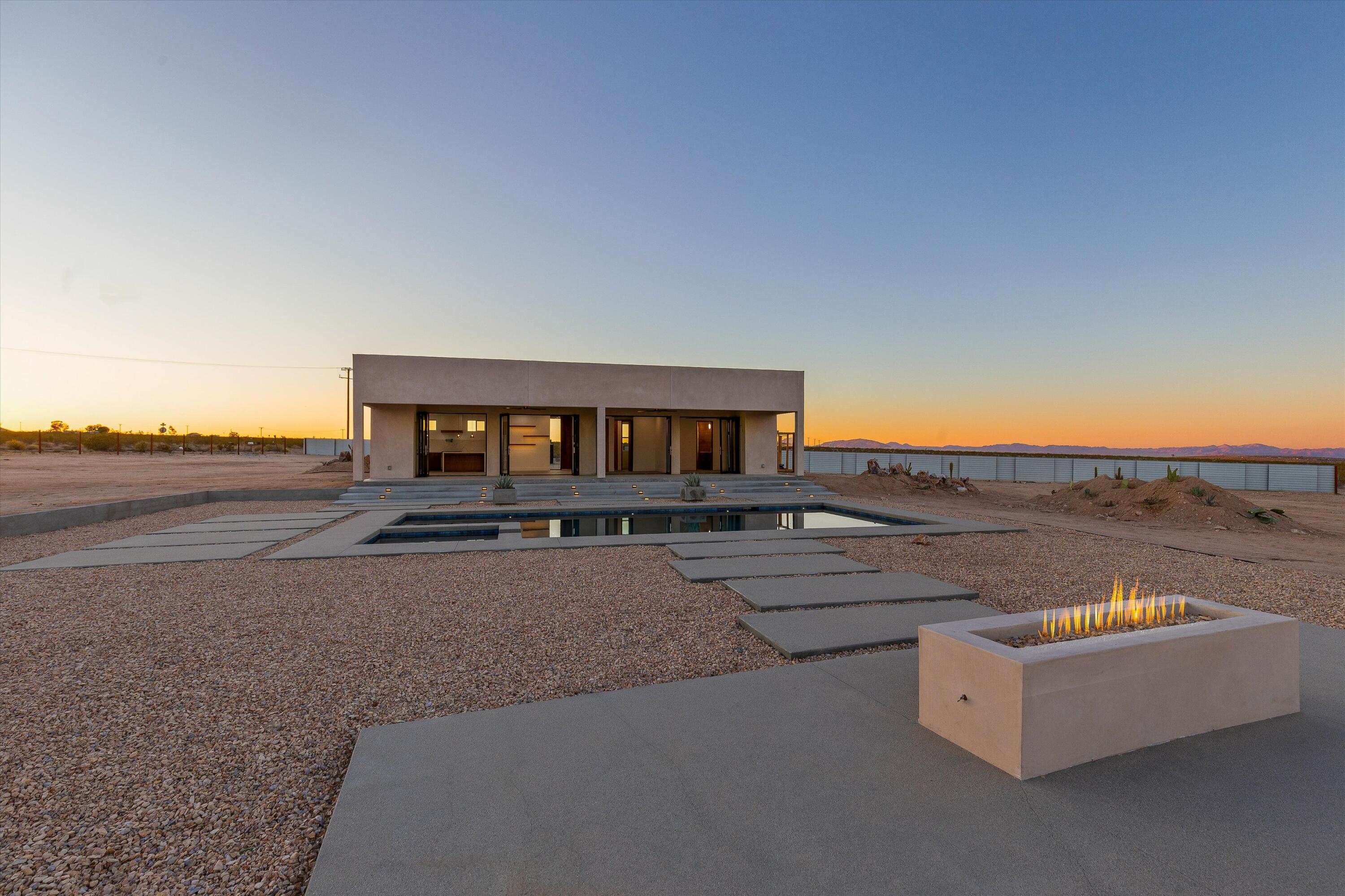 1925 Border Avenue Joshua Tree, CA 92252 - Photo 26 of 60 an outdoor view of house with ocean view