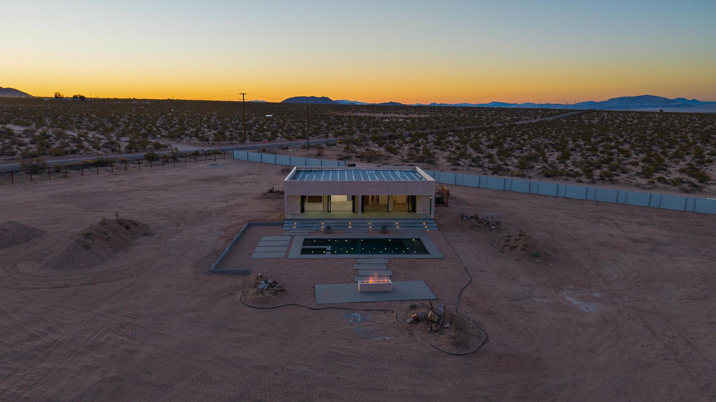 1925 Border Avenue Joshua Tree, CA 92252 - Photo 27 of 60 a front view of a house with a yard