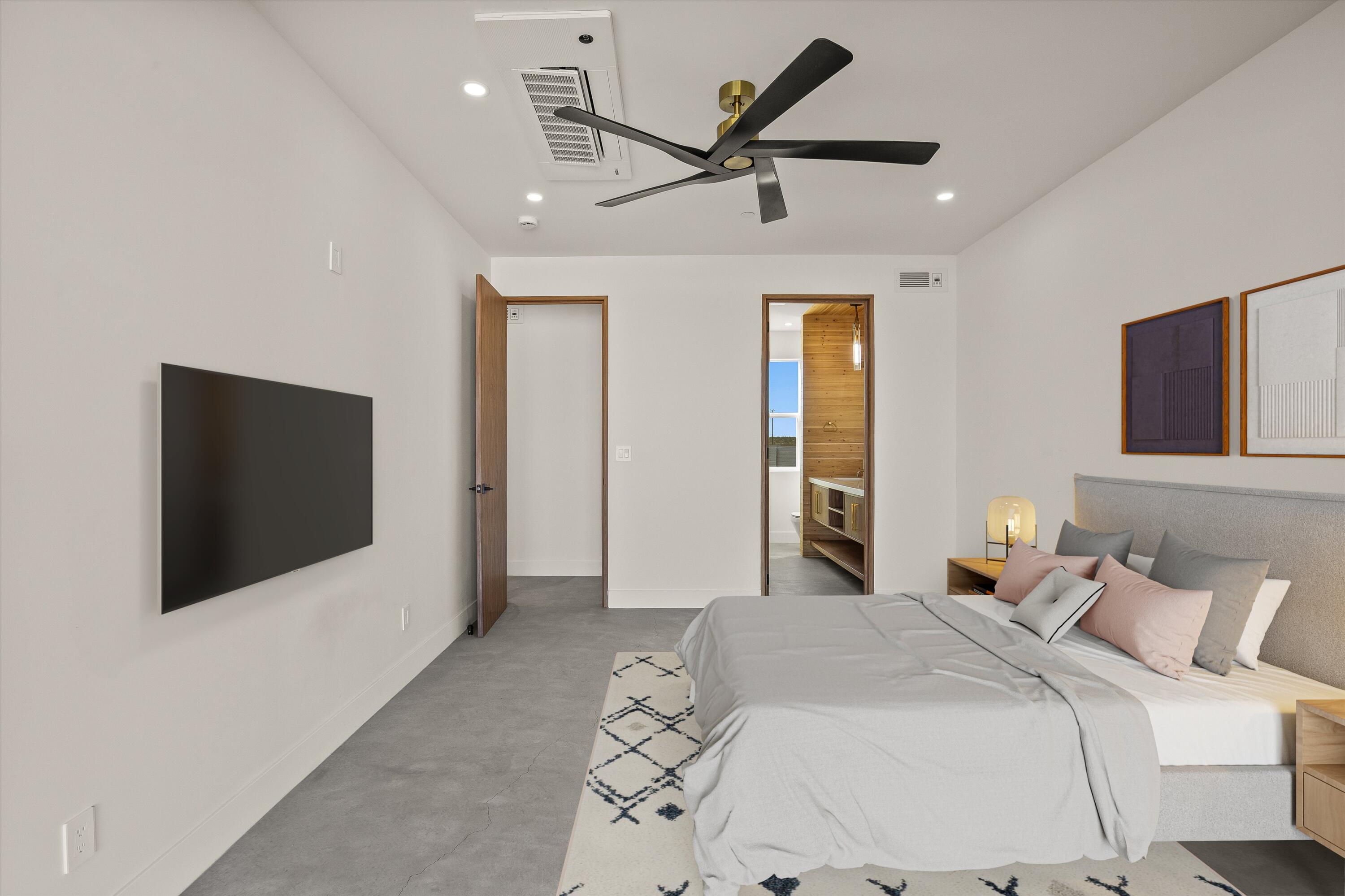 1925 Border Avenue Joshua Tree, CA 92252 - Photo 30 of 60 a bedroom with a bed and a flat screen tv