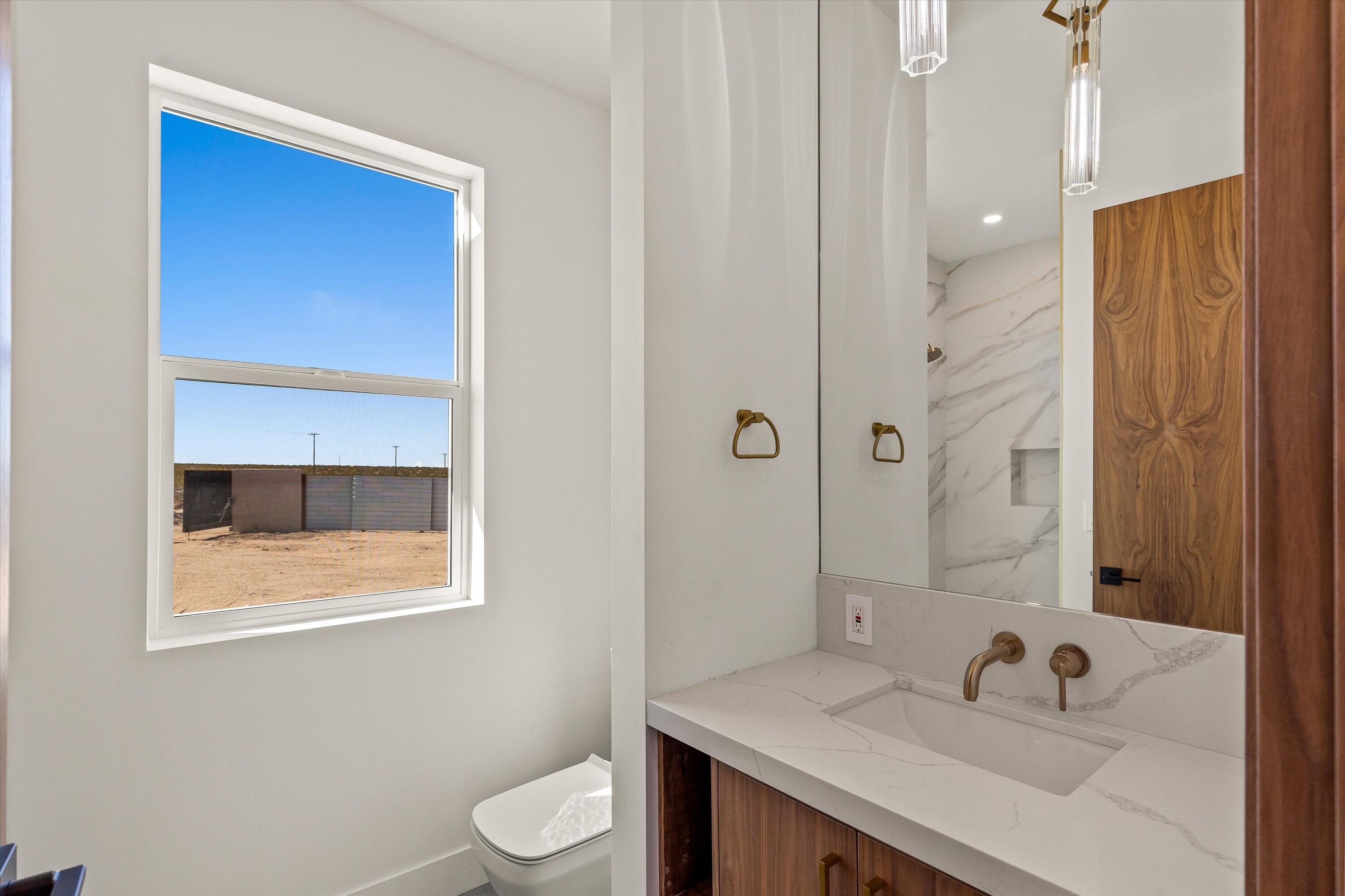 1925 Border Avenue Joshua Tree, CA 92252 - Photo 39 of 60 a bathroom with a sink a toilet and shower