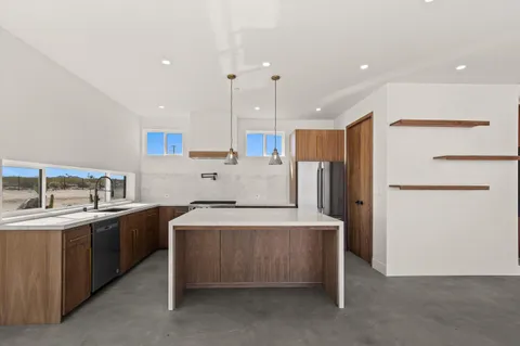 a front view of a house with a ocean view