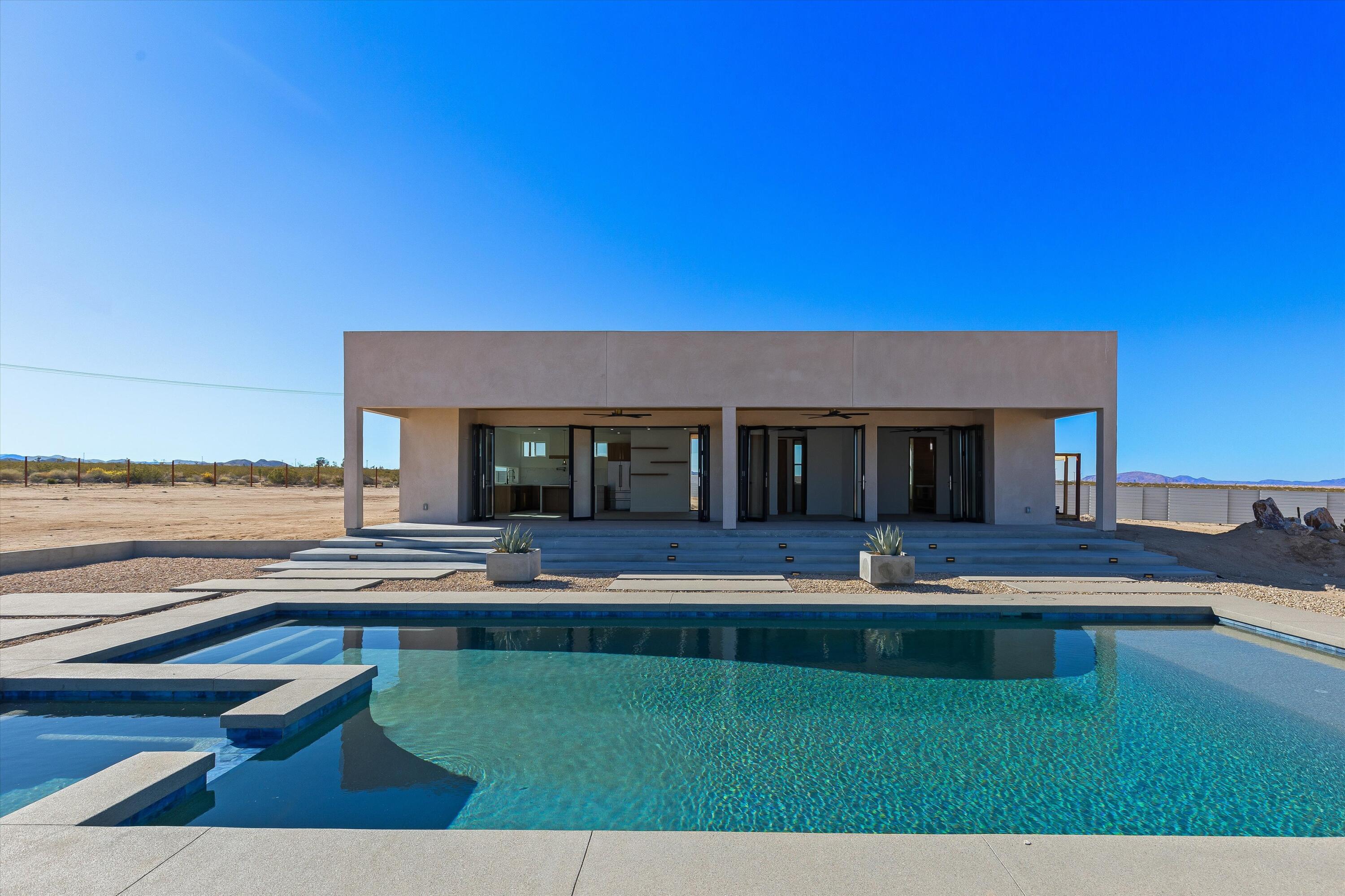 1925 Border Avenue Joshua Tree, CA 92252 - Photo 45 of 60 a view of house with swimming pool and outdoor space