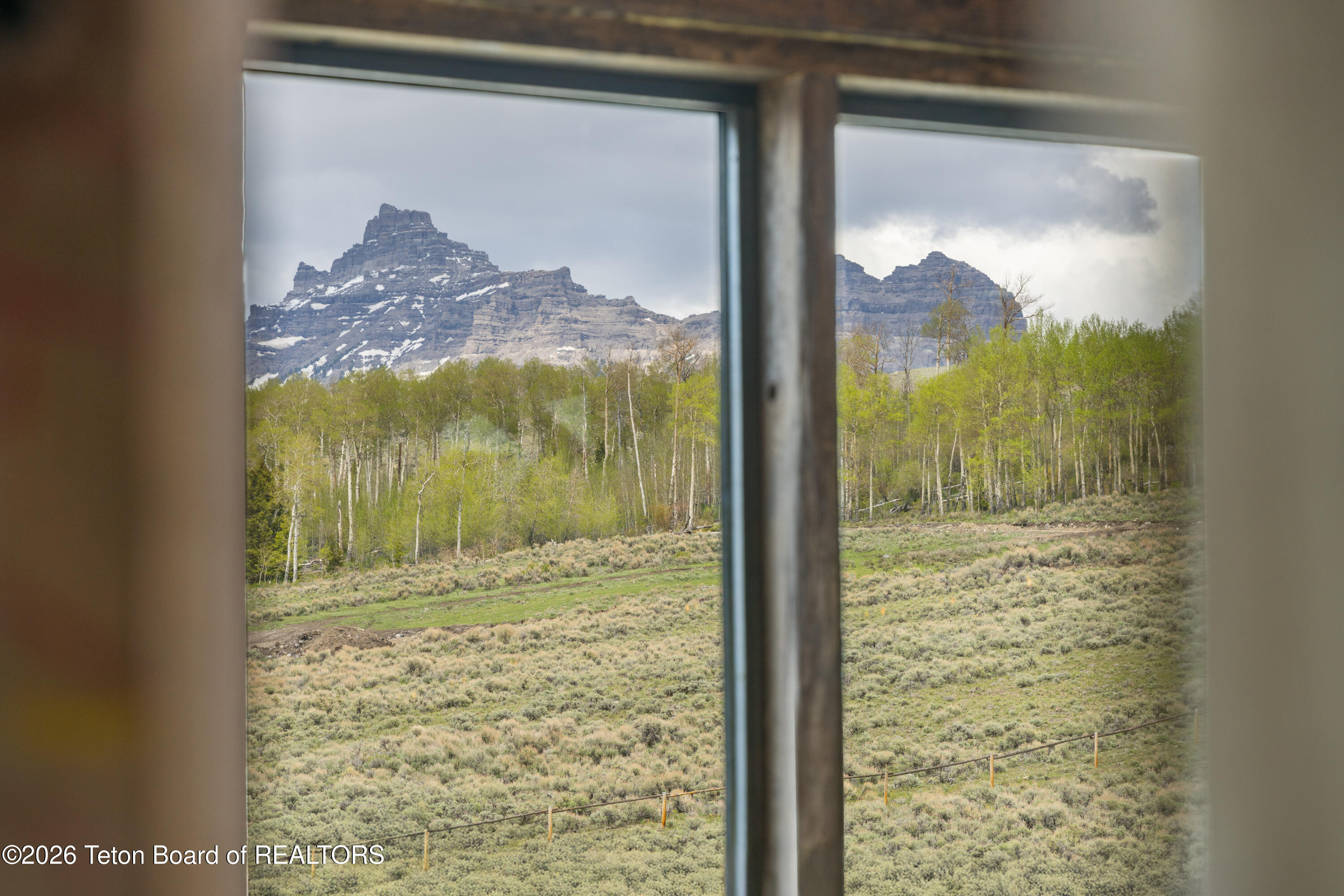 169 Ramshorn Ranch Road Dubois, WY 82513 - Photo 15 of 21 through a bedroom window