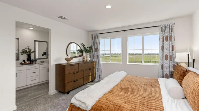 a bed room with a bed and a dresser