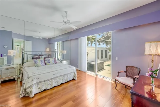 a bed room with a bed and a chair