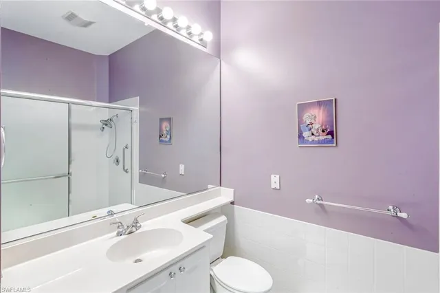 a bathroom with a bathtub shower sink and toilet