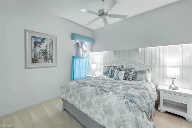 a bedroom with two beds and a window