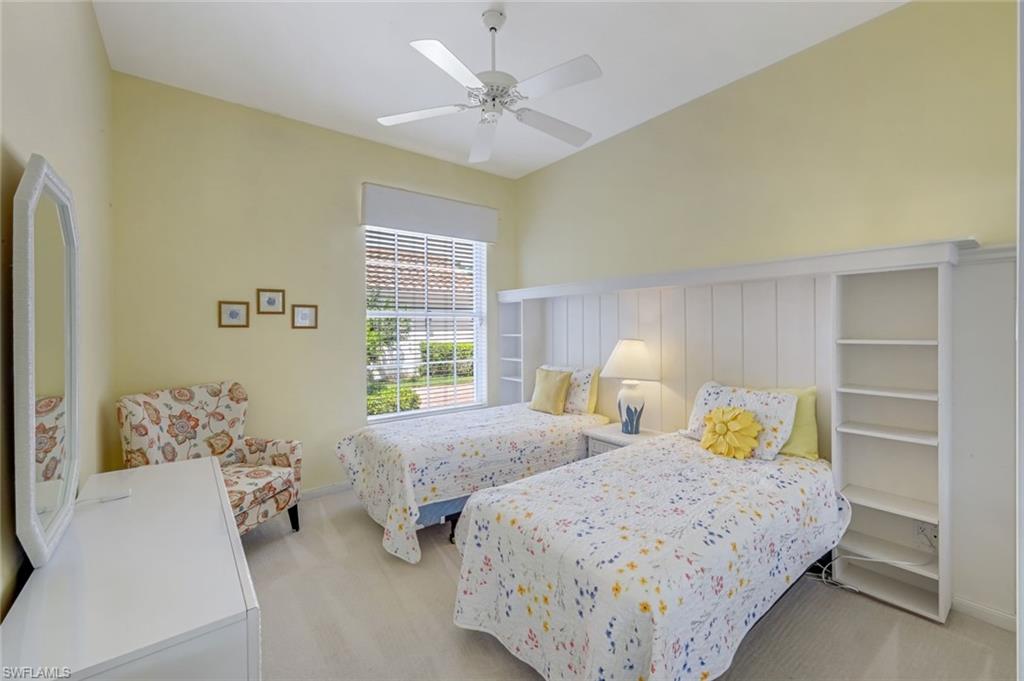 3794 Whidbey Way Naples, FL 34119 - Photo 22 of 46 a bedroom with two beds and a window