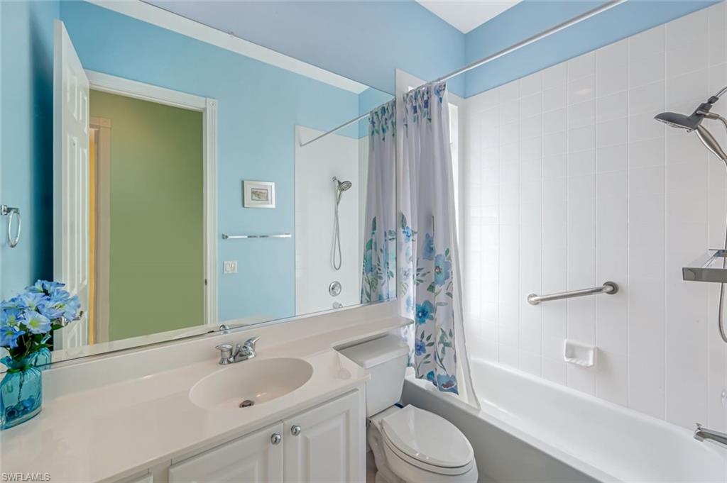 3794 Whidbey Way Naples, FL 34119 - Photo 23 of 46 a bathroom with a sink toilet tub and shower