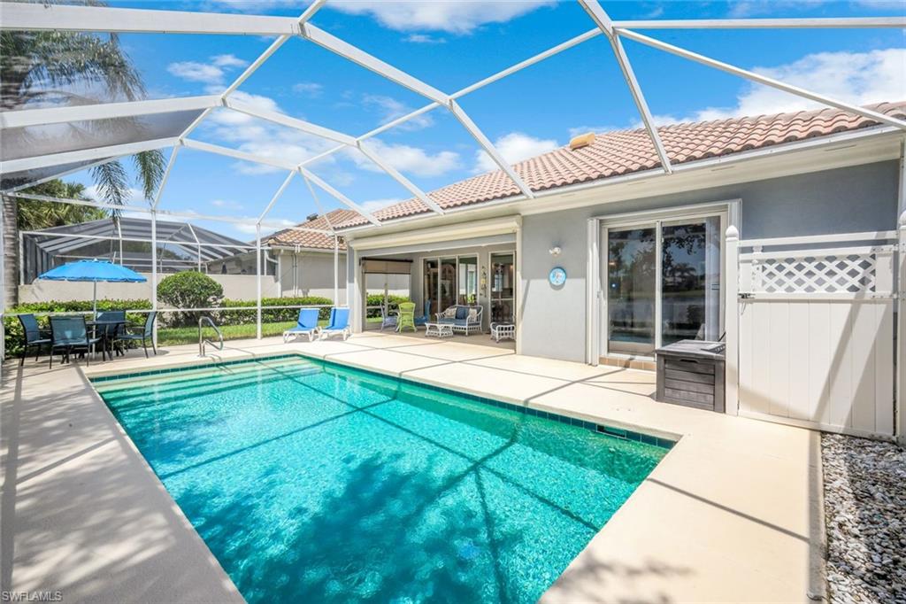 3794 Whidbey Way Naples, FL 34119 - Photo 28 of 46 a view of swimming pool with a patio and a yard