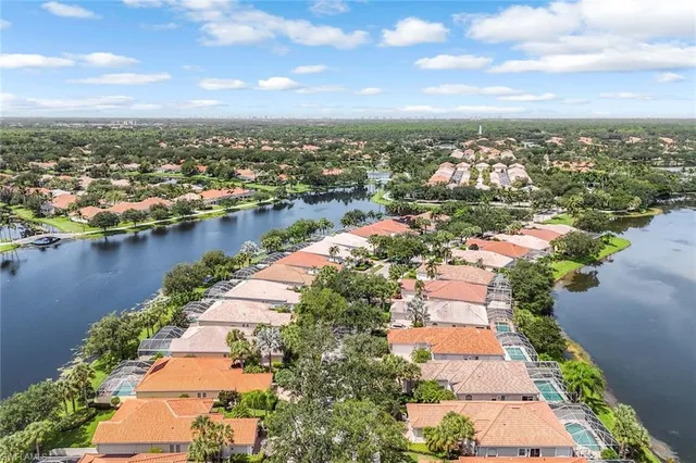 an aerial view of city and lake