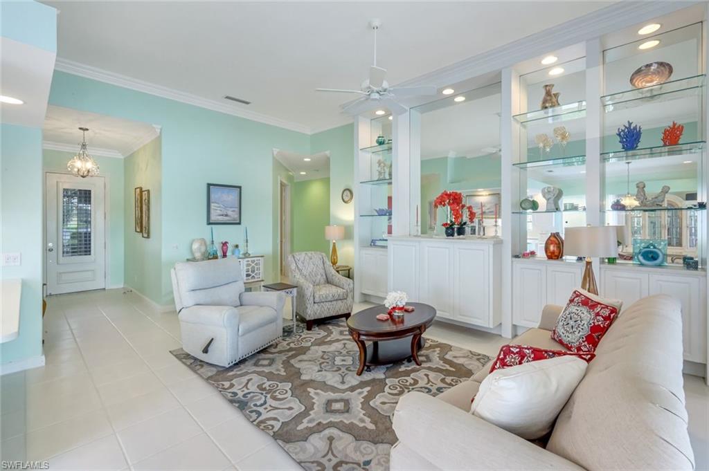 3794 Whidbey Way Naples, FL 34119 - Photo 8 of 46 a living room with furniture and a large window