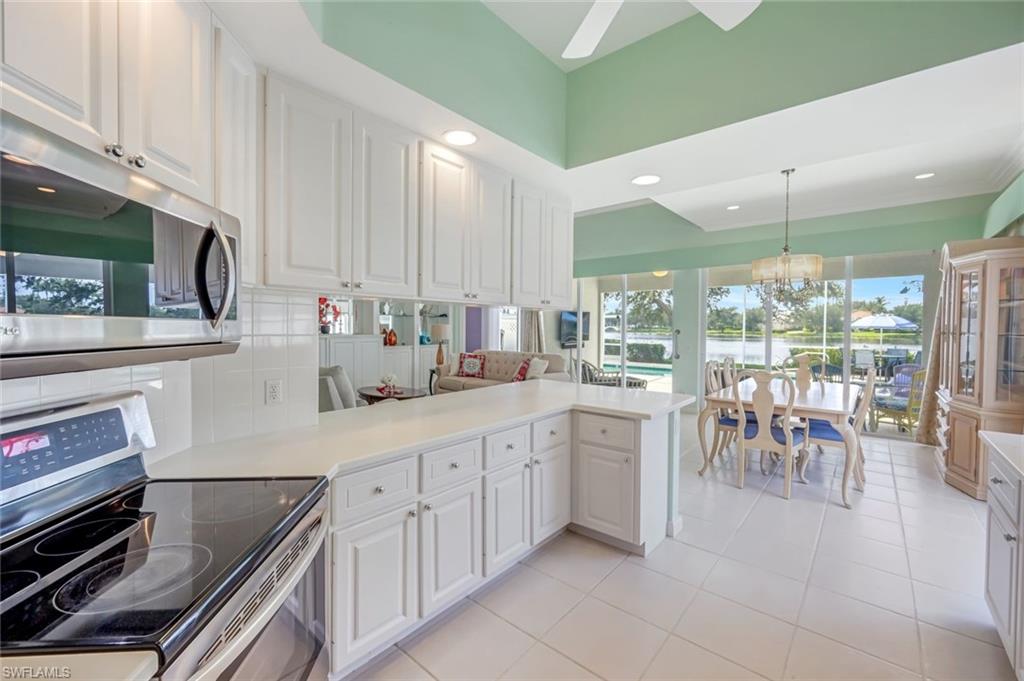 3794 Whidbey Way Naples, FL 34119 - Photo 10 of 46 a kitchen with lots of counter top space and appliances