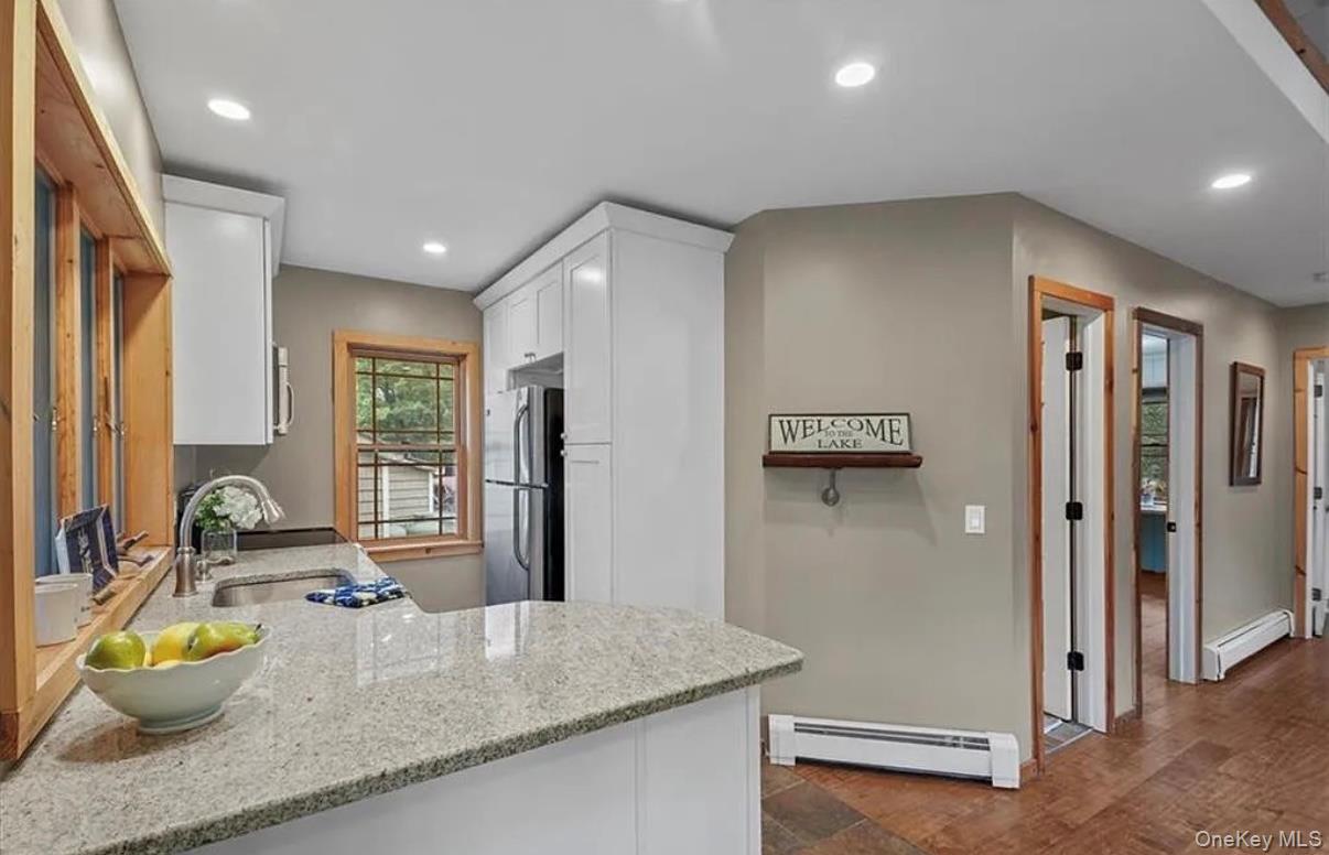 11 Oakdale Road Putnam Valley, NY 10579 - Photo 5 of 31 a bathroom with a granite countertop sink and a mirror