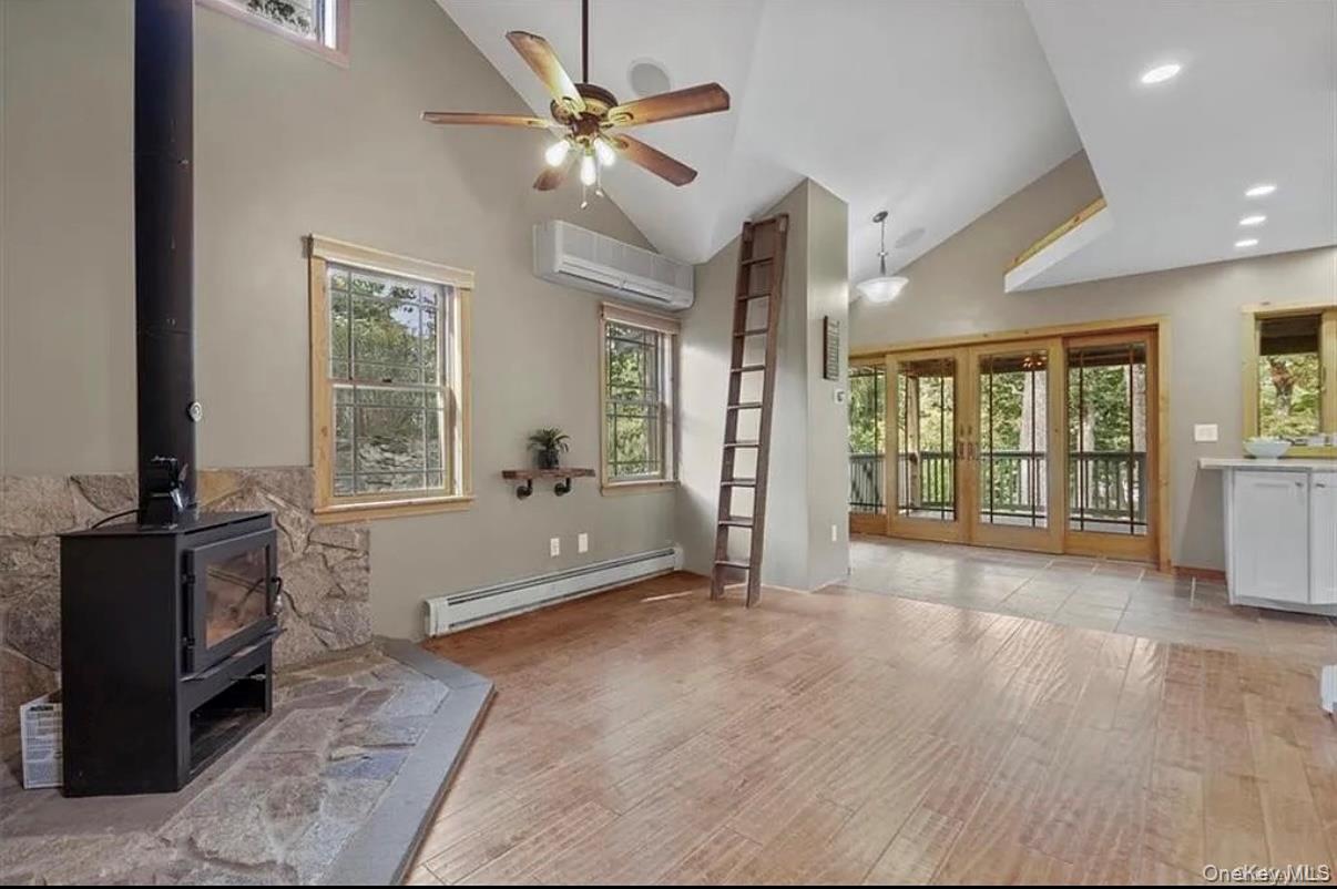 11 Oakdale Road Putnam Valley, NY 10579 - Photo 9 of 31 a view of an empty room with a fireplace and a large window