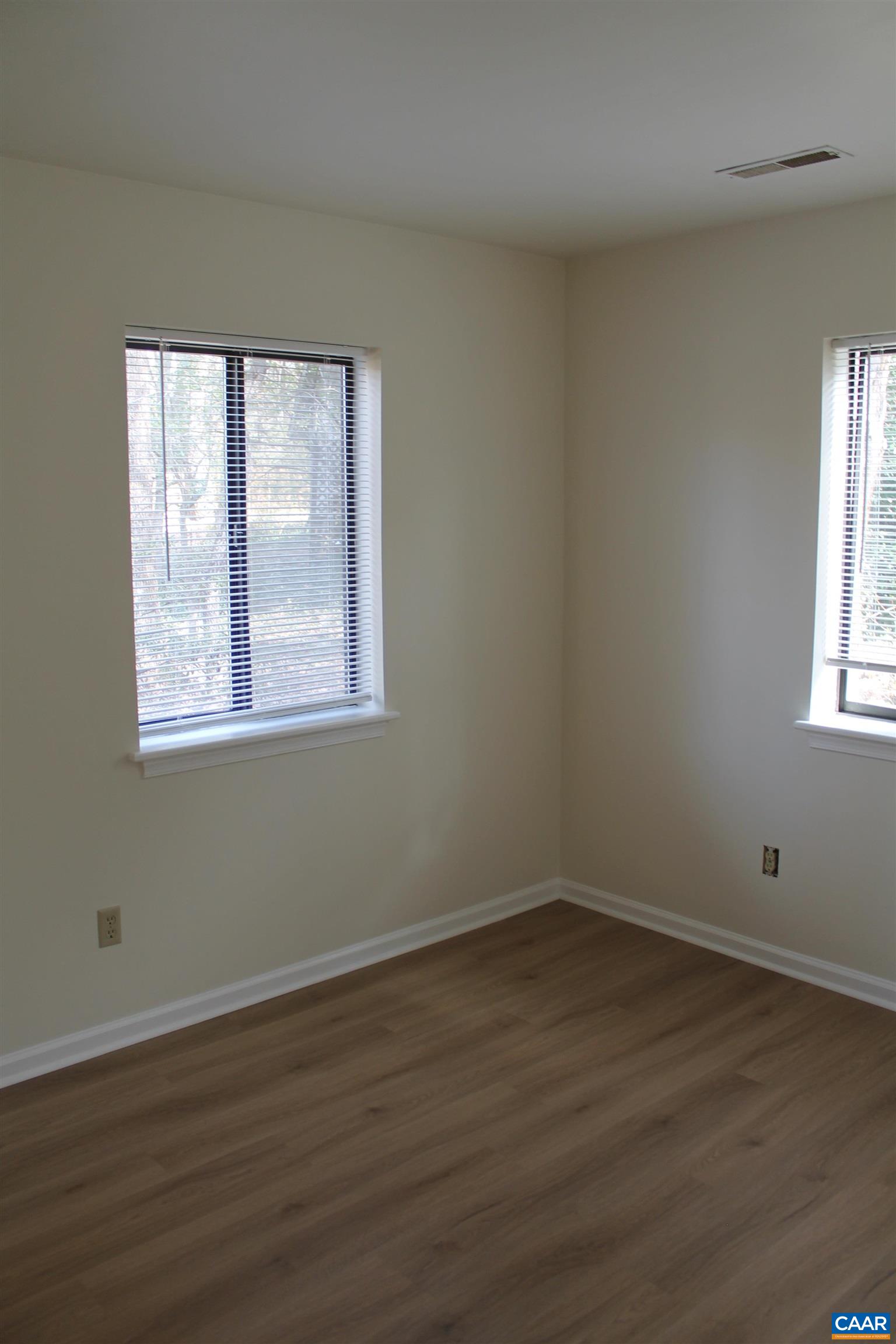 118 Mill Creek Drive Charlottesville, VA 22902 - Photo 13 of 30 a view of a room with wooden floor and windows