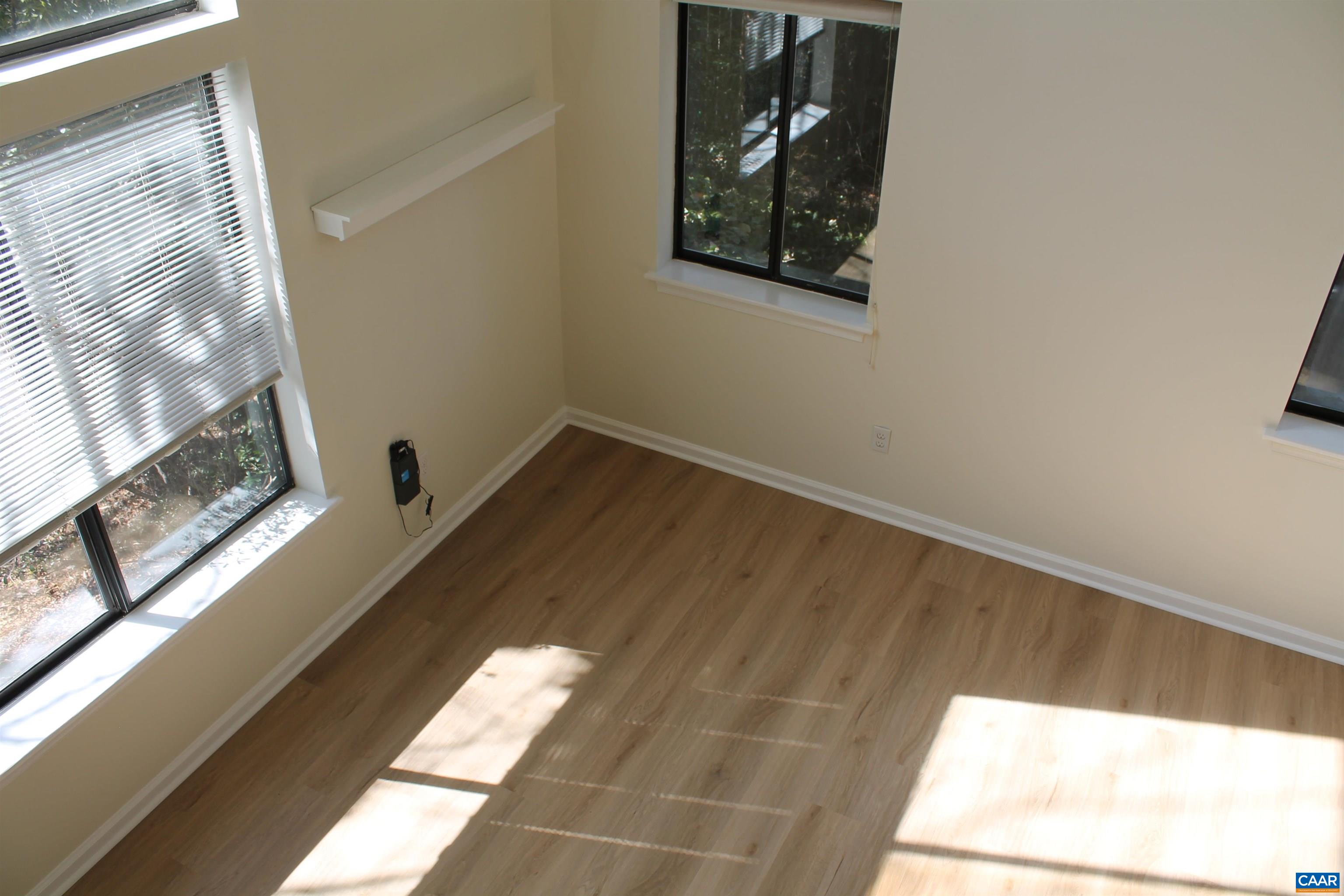 118 Mill Creek Drive Charlottesville, VA 22902 - Photo 26 of 30 a view of small space with wooden floor and a window