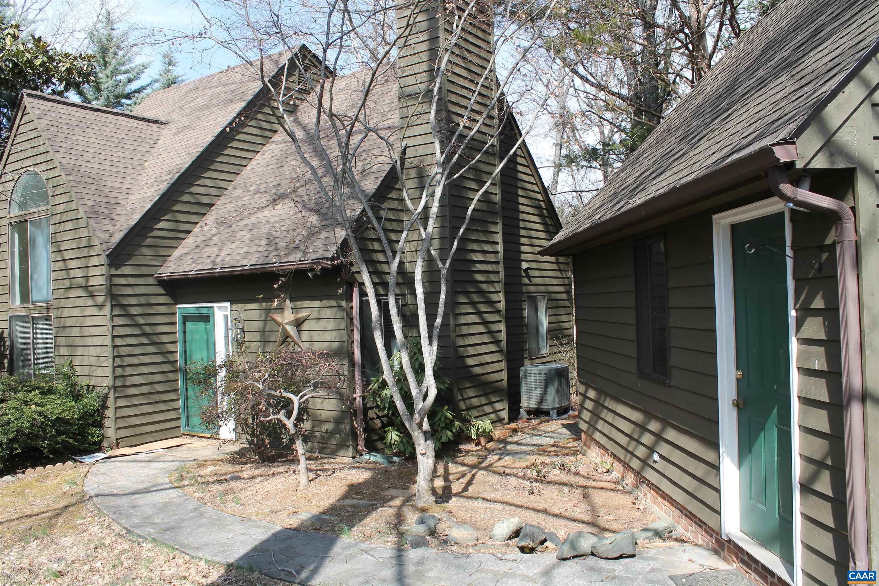 118 Mill Creek Drive Charlottesville, VA 22902 - Photo 4 of 30 a yellow house with trees in front of it