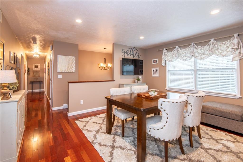 25 Stinedurf Road West Middlesex, PA 16159 - Photo 12 of 25 ADJOINING CASUAL LIVING ROOM WITH GLEAMING CHERRY HARDWOOD FLOORS. BRIGHT, LARGE WINDOW ADDS TO THE PLEASANTRY OF THE ROOM.