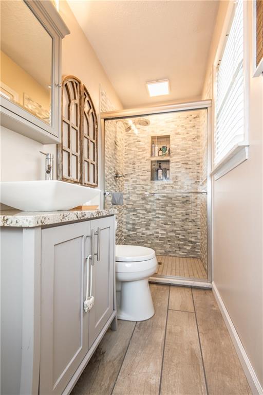 25 Stinedurf Road West Middlesex, PA 16159 - Photo 16 of 25 MAST. BATH HAS "EUROPEAN" STYLE SINK. THE WHITE CABINETRY ADDS TO THE BRIGHTNESS OF THE AREA. NICELY UPDATED TILE SHOWER, ...A GREAT LOOK!