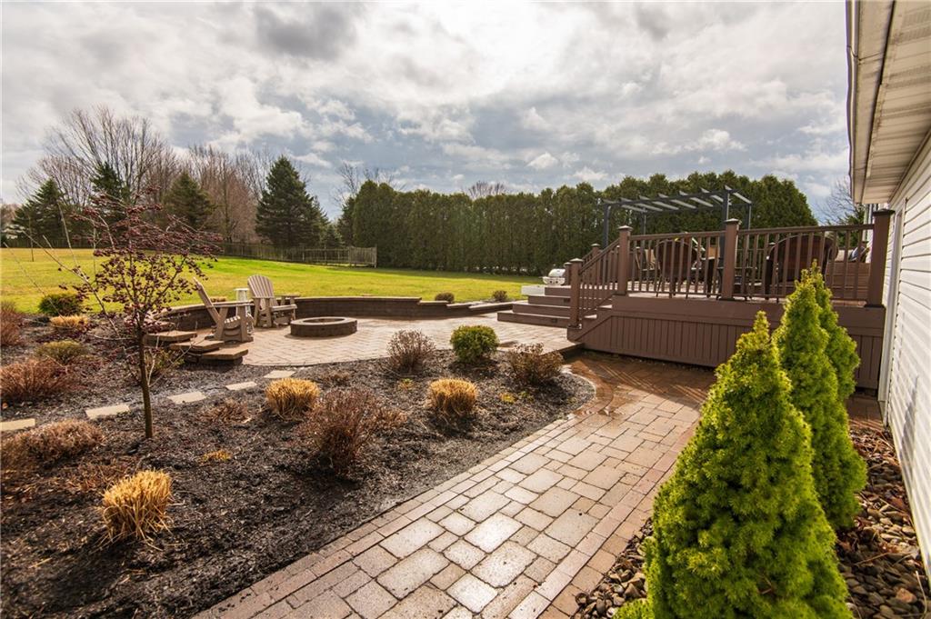 25 Stinedurf Road West Middlesex, PA 16159 - Photo 5 of 25 OUTDOOR PATIO PROVIDES A 2-TIER COMOPOSITE DECK...JUST STEPS TO ARTIFULLY LANDSCAPED STONE PATIO WITH FIRE PIT, AND PAVER SIDEWALK.... AN AWESOME BACKYARD AREA!