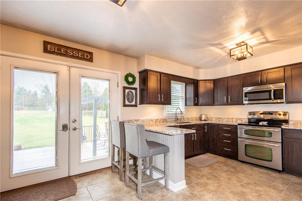25 Stinedurf Road West Middlesex, PA 16159 - Photo 10 of 25 LOTS OF SUNLIGHT FROM THE EAST-FACING KITCHEN. A VERY PLEASANT SURROUNDING!