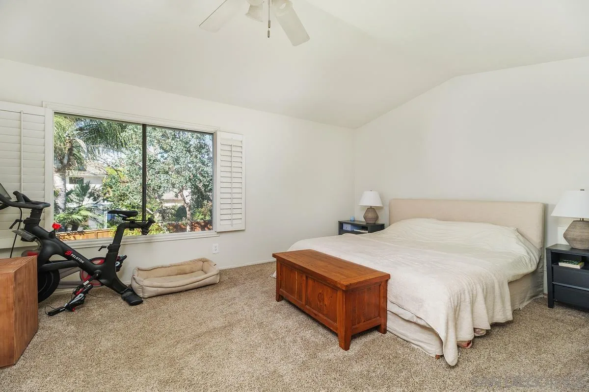41573 Willow Run Road Temecula, CA 92591 - Photo 20 of 32 a bedroom with a bed and a table