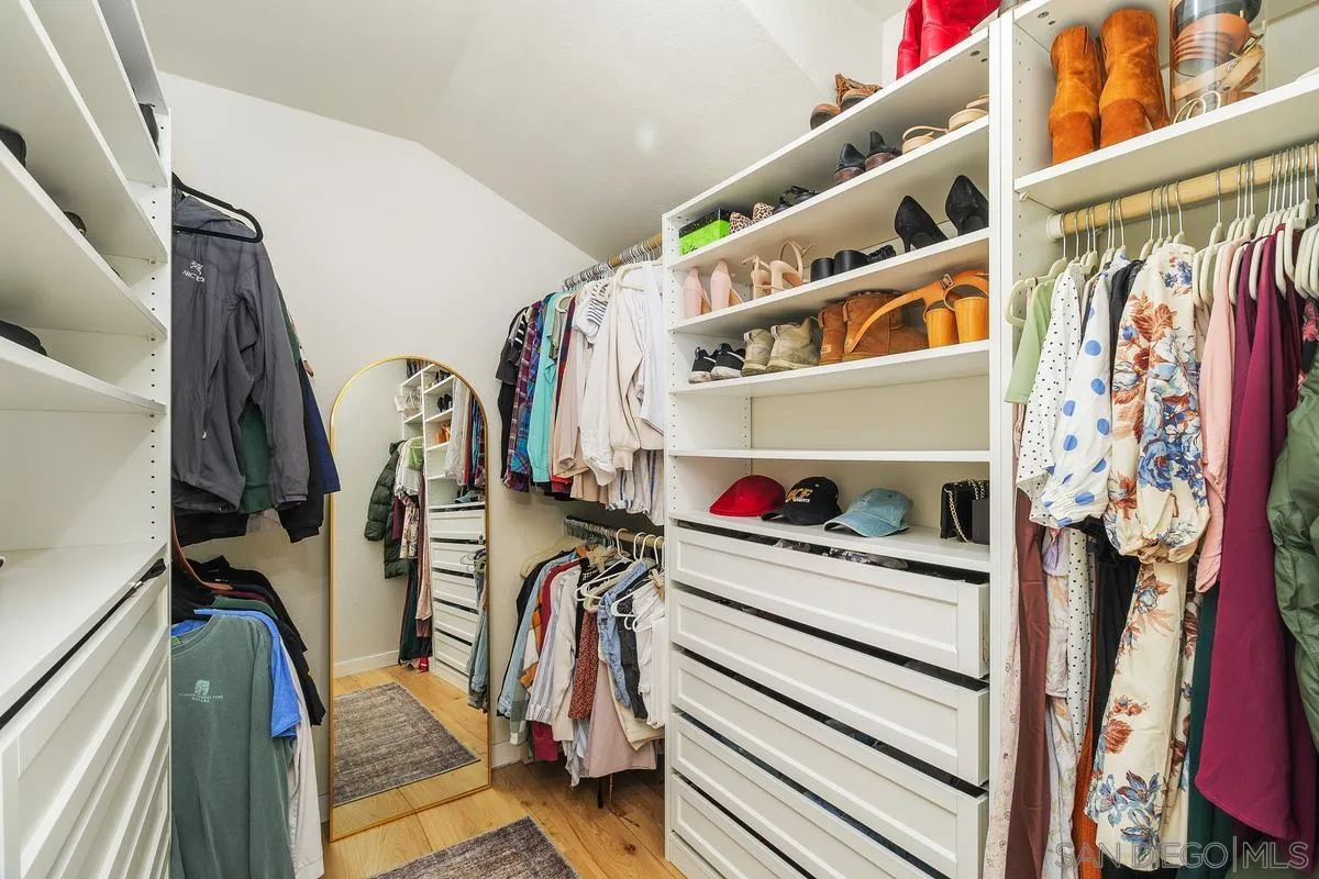 41573 Willow Run Road Temecula, CA 92591 - Photo 23 of 32 a view of walk in closet with clothes and shoes