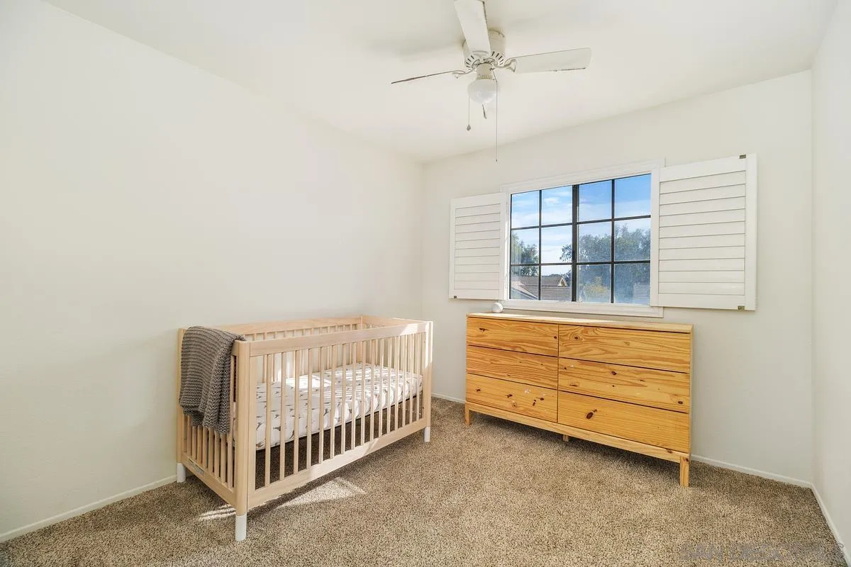 41573 Willow Run Road Temecula, CA 92591 - Photo 25 of 32 a bedroom with a bed and a window
