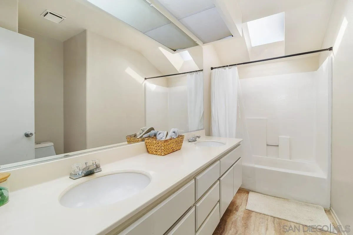 41573 Willow Run Road Temecula, CA 92591 - Photo 26 of 32 a bathroom with a granite countertop sink and a mirror