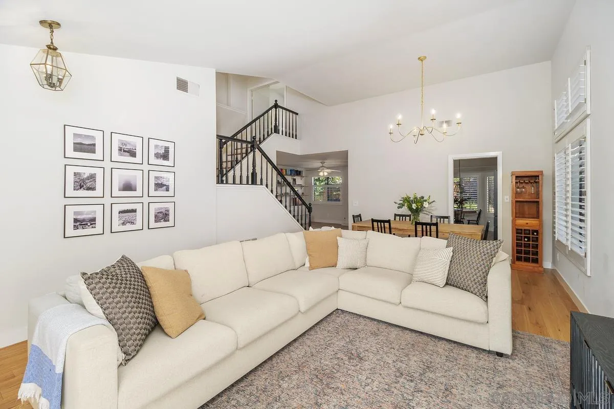 41573 Willow Run Road Temecula, CA 92591 - Photo 6 of 32 a living room with furniture and a chandelier