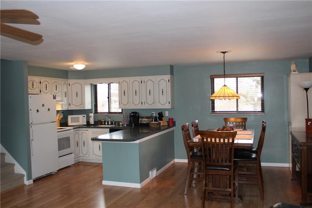 960 Lindsay Road Carnegie, PA 15106 - Photo 5 of 24 Kitchen features electric stove, dishwasher, plenty of cabinetry for storage and solid surface countertops.