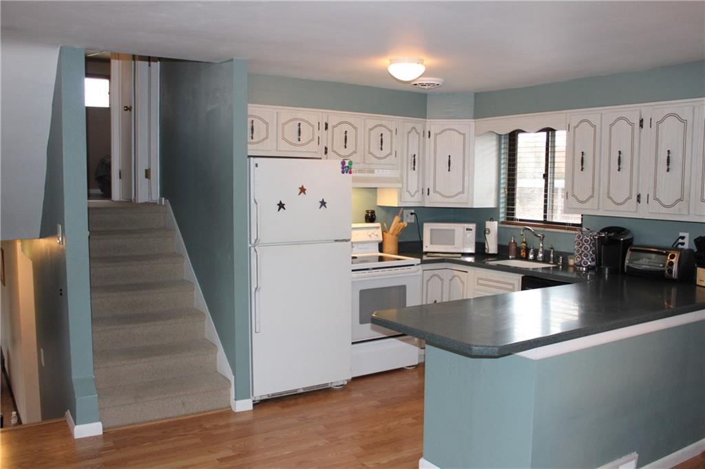 960 Lindsay Road Carnegie, PA 15106 - Photo 7 of 24 Kitchen adjacent to stairs lead to upper and lower levels.