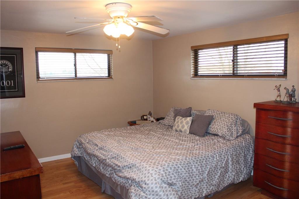960 Lindsay Road Carnegie, PA 15106 - Photo 8 of 24 Master Bedroom with laminate wood flooring and ceiling fan is large enough to comfortably accommodate a king size bed.