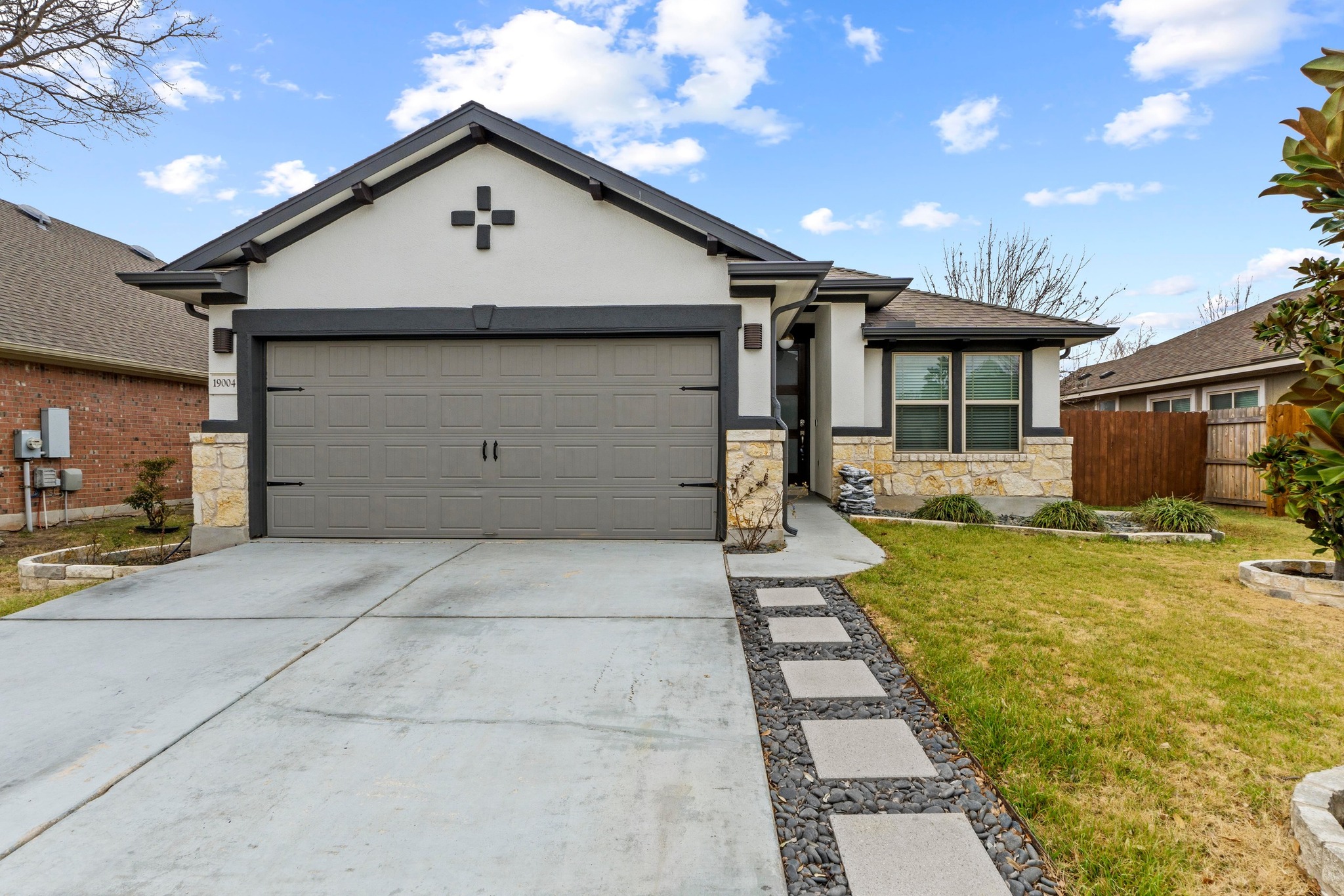 19004 Mangan Way Pflugerville, TX 78660 - Photo 1 of 38 Contemporary curb appeal and fresh landscaping welcome you to this stunning move-in ready home.