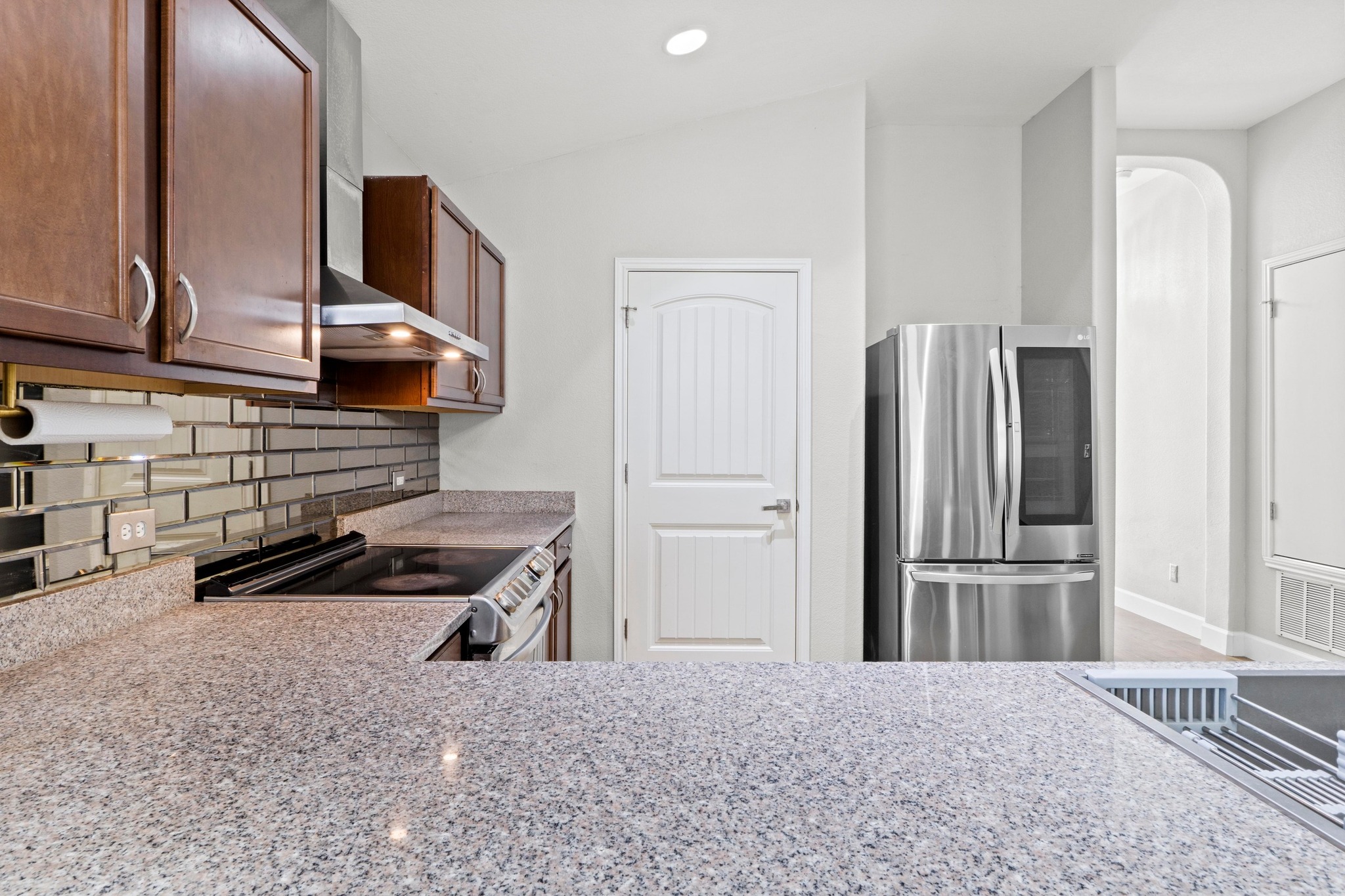 19004 Mangan Way Pflugerville, TX 78660 - Photo 14 of 38 This modern kitchen is move-in ready, featuring a spacious layout that overlooks the rest of the open-concept home