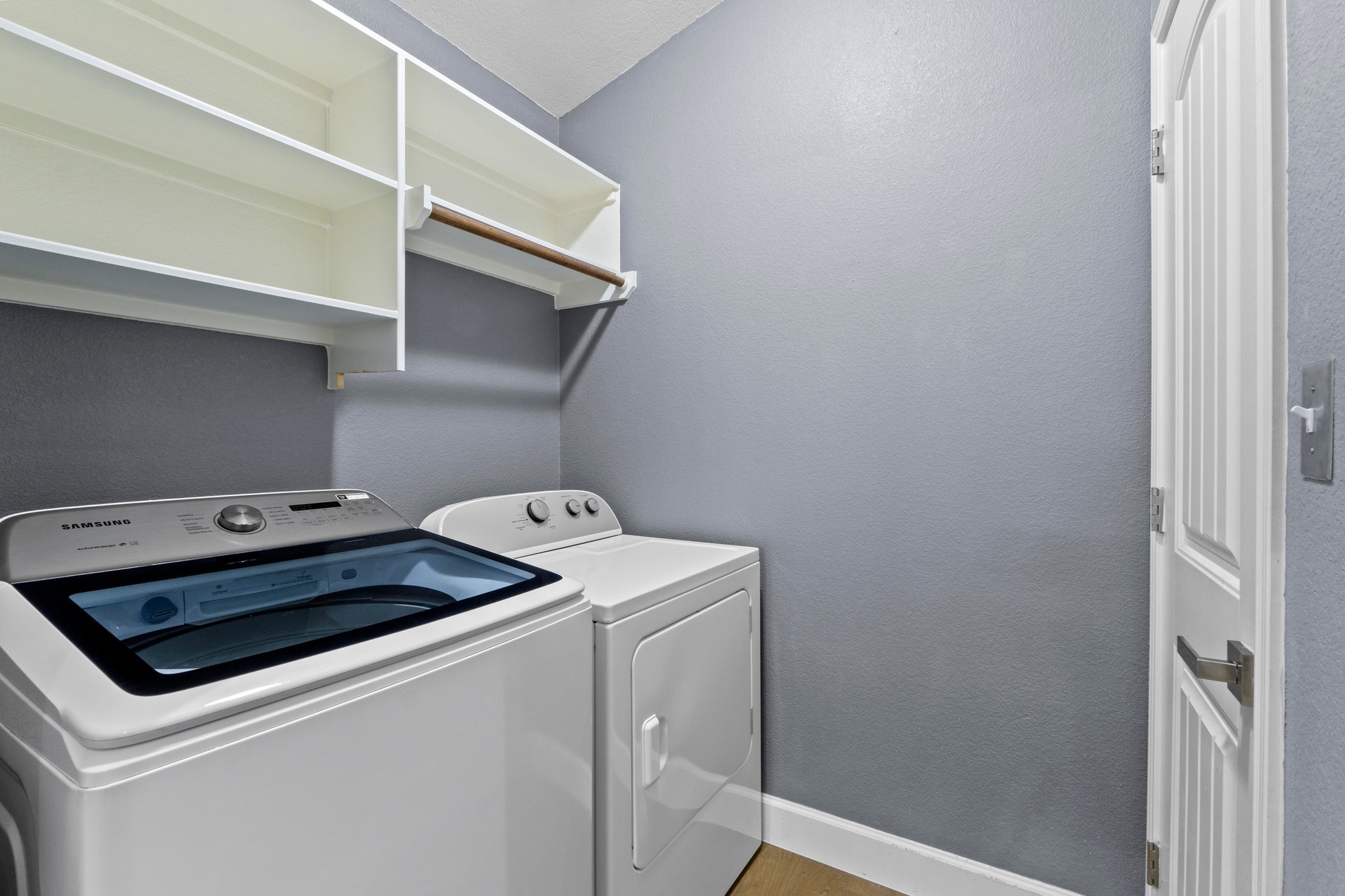 19004 Mangan Way Pflugerville, TX 78660 - Photo 27 of 38 The dedicated laundry room has built-in overhead cabinetry for extra storage.