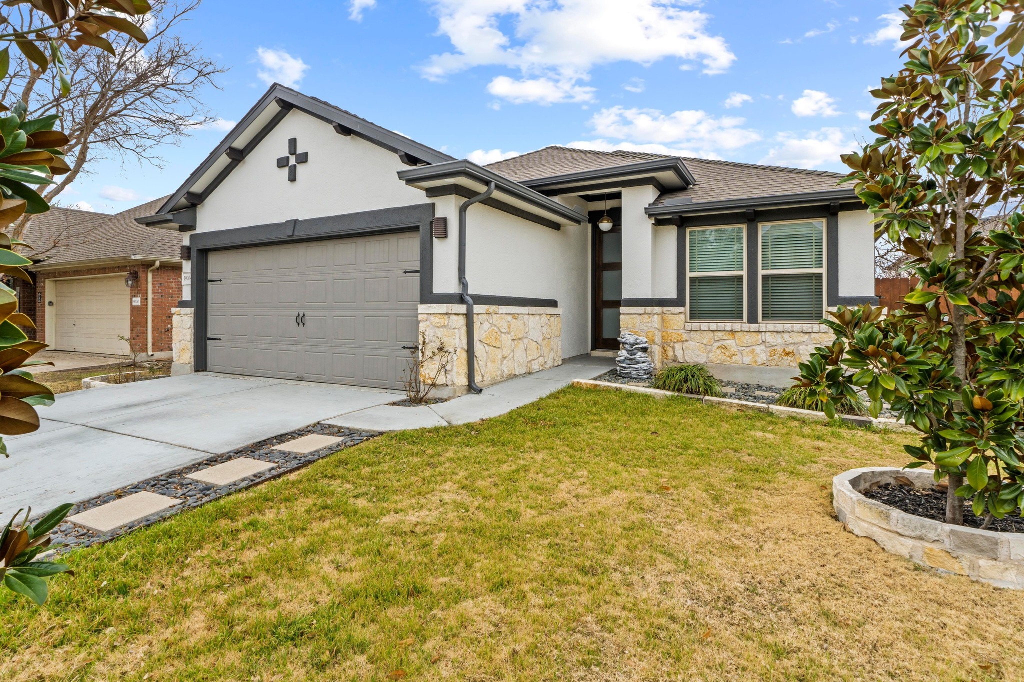 19004 Mangan Way Pflugerville, TX 78660 - Photo 3 of 38 The two car garage offers plenty of room for your vehicles or additional storage.
