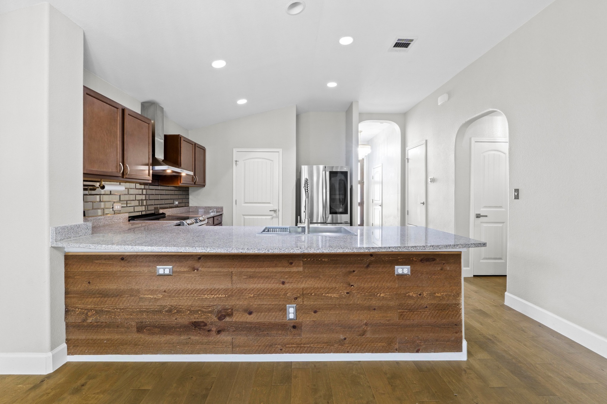 19004 Mangan Way Pflugerville, TX 78660 - Photo 10 of 38 This home defines modern living and the seamless flow between the kitchen, dining, and living rooms ensures you never miss a moment.