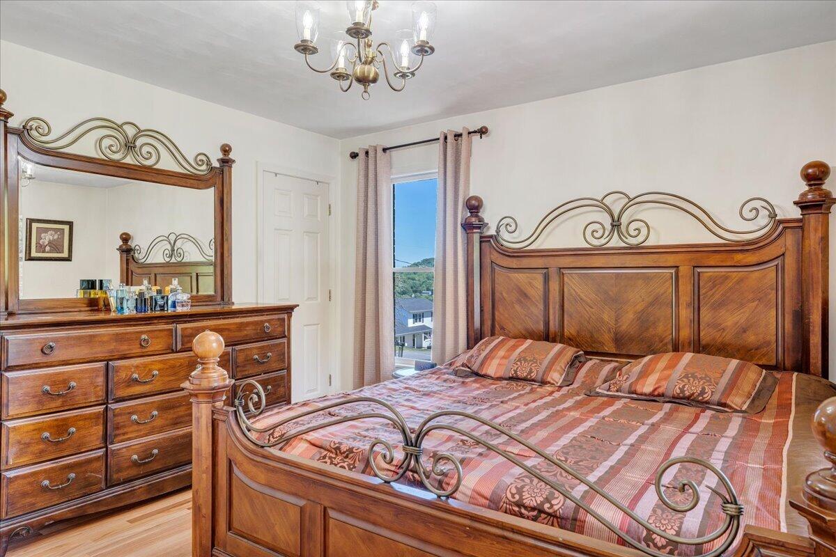 4434 Rosecrest Road Roanoke, VA 24018 - Photo 19 of 48 a bedroom with a bed and a mirror on the dresser