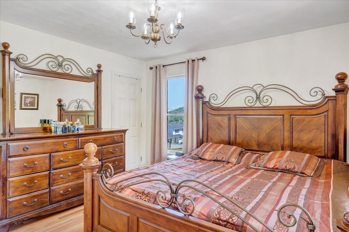 4434 Rosecrest Road Roanoke, VA 24018 - Photo 20 of 48 a bedroom with a large bed and a mirror on dresser